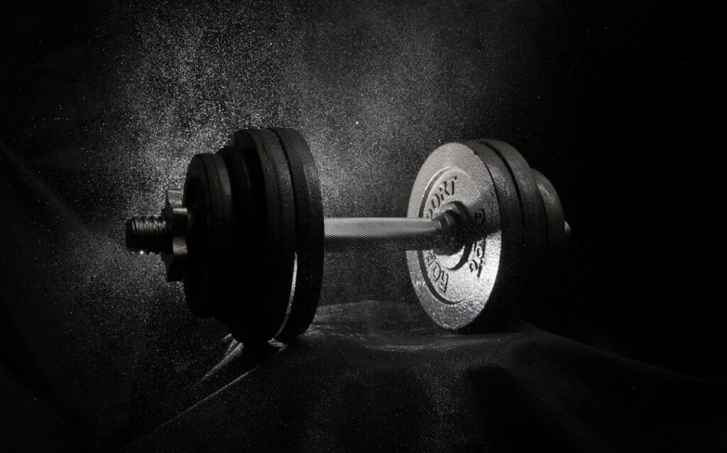 A dumbbell photographed in black and white